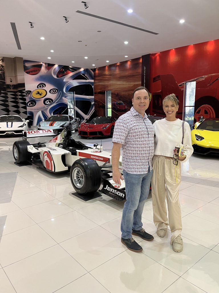 Clint and Caroline Stanbury at the crown prince's race car personal garage