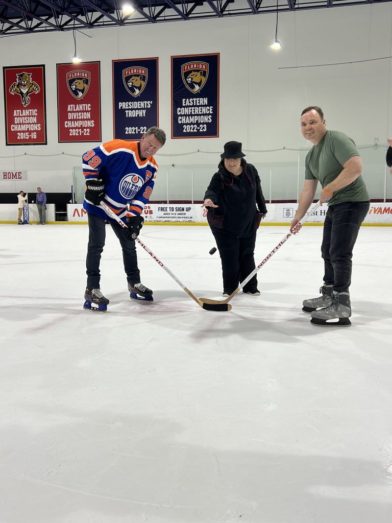 Clint Faces off with Wayne Gretzky for the puck