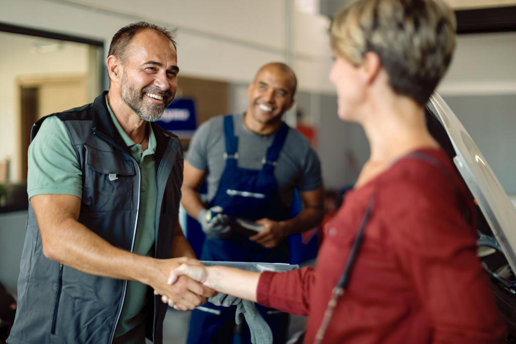 HVAC business owner shaking hands with a strategic acquirer after closing the sale