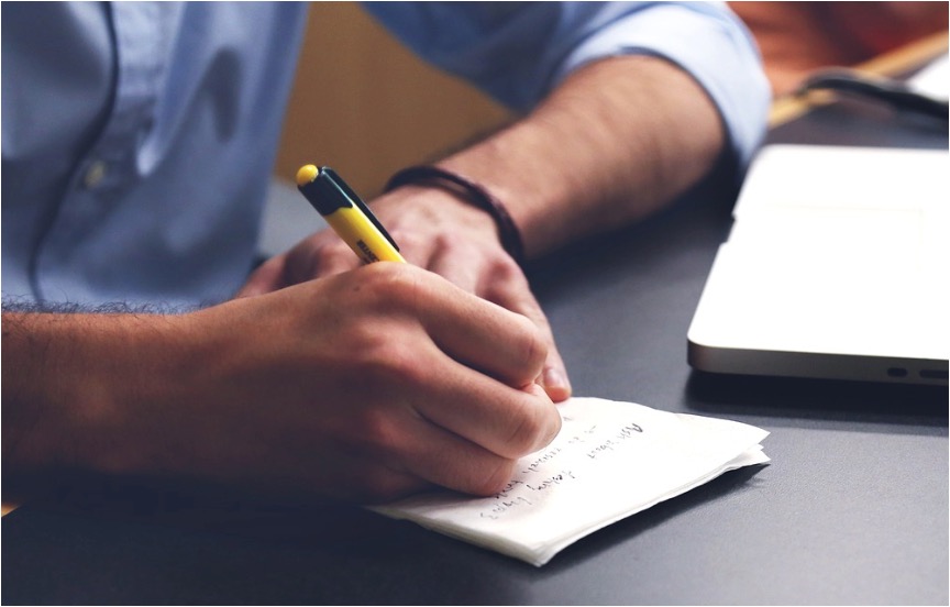 A businessman outlining his goals before creating a business exit strategy