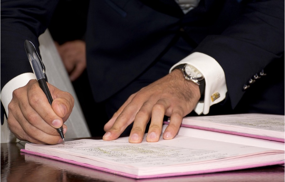A businessman reviewing plumbing business valuation multiples on financial documents