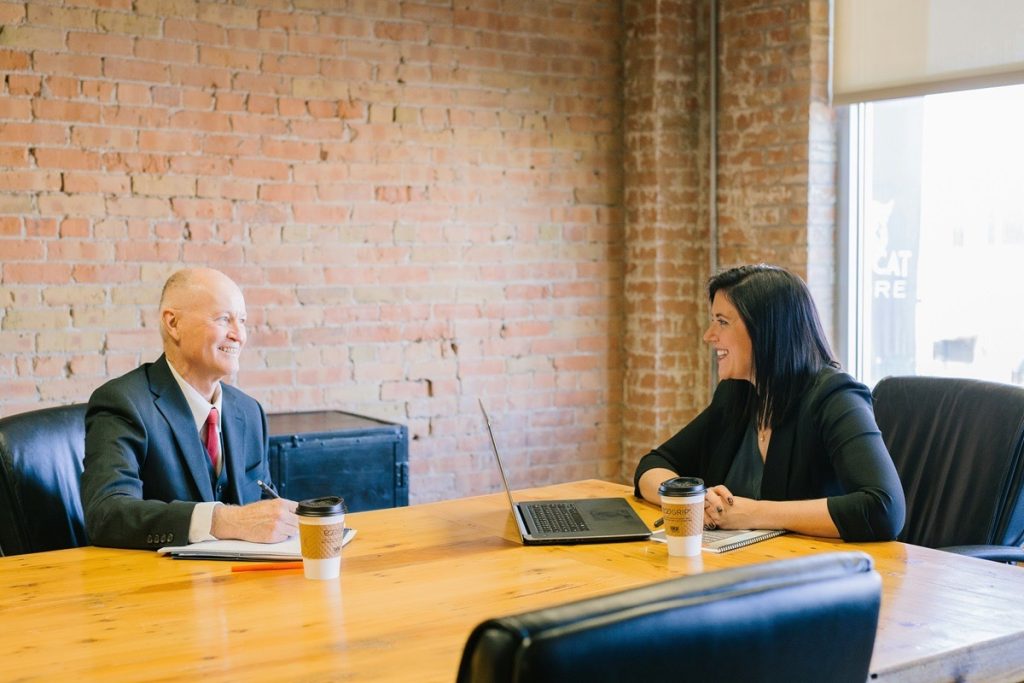 Business owner meeting with an advisor to review net proceeds from a sale.